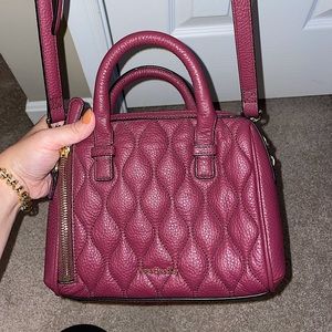 NEVER used leather Vera Bradley bag! Adjustable strap. Maroon color.